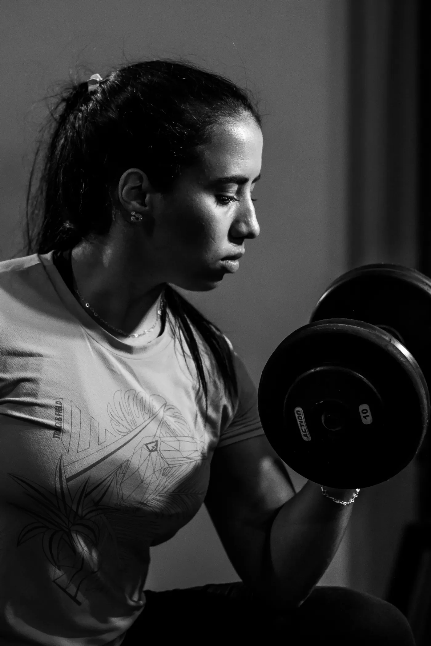 Woman lifting a dumbbell during strength training
