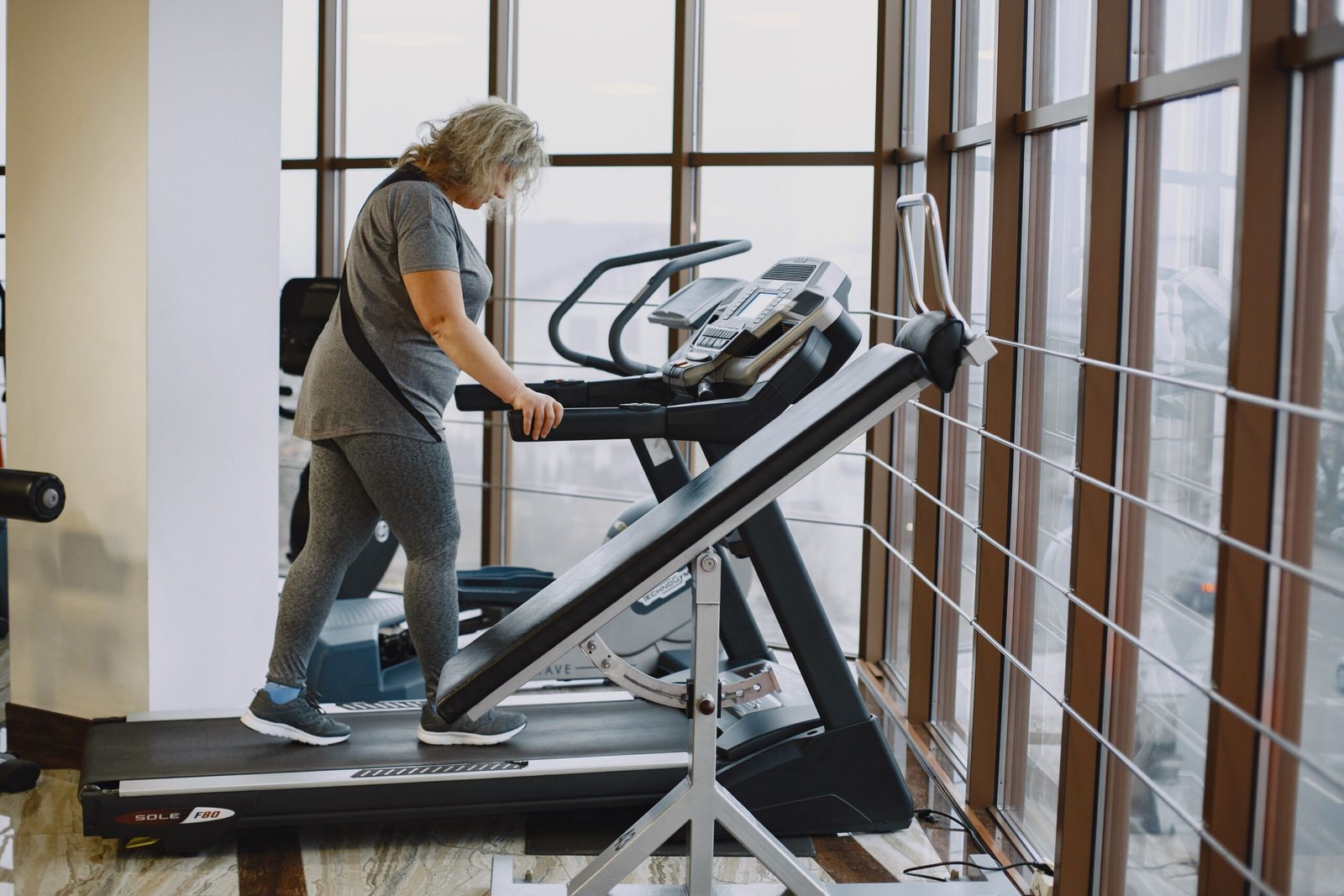 Woman running on a treadmill during an endurance workout