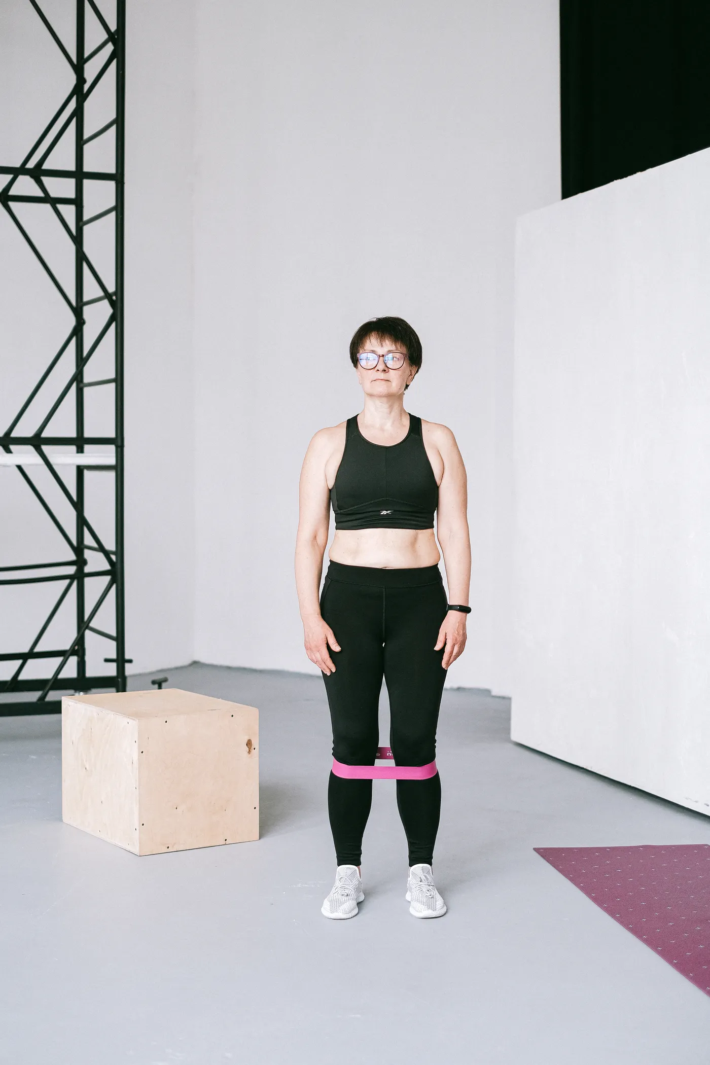 Woman using a resistance band during an indoor workout