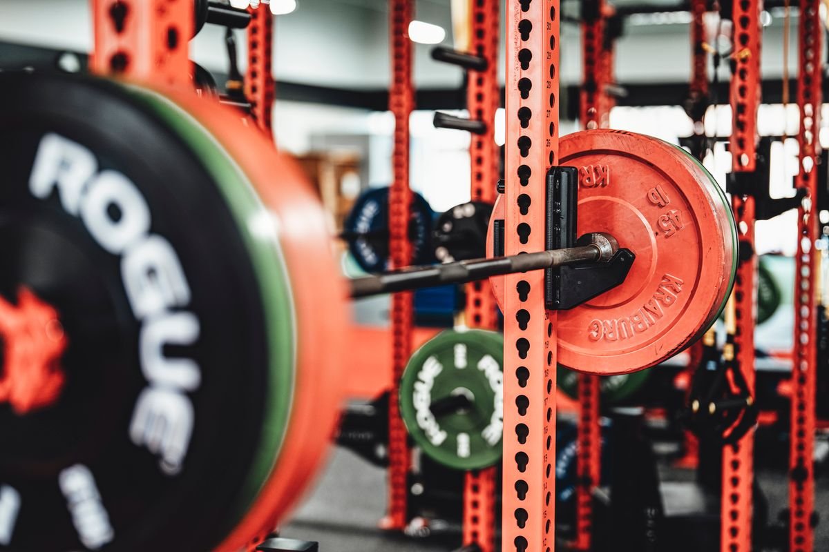 Barbell and weight plates prepared for progressive strength training