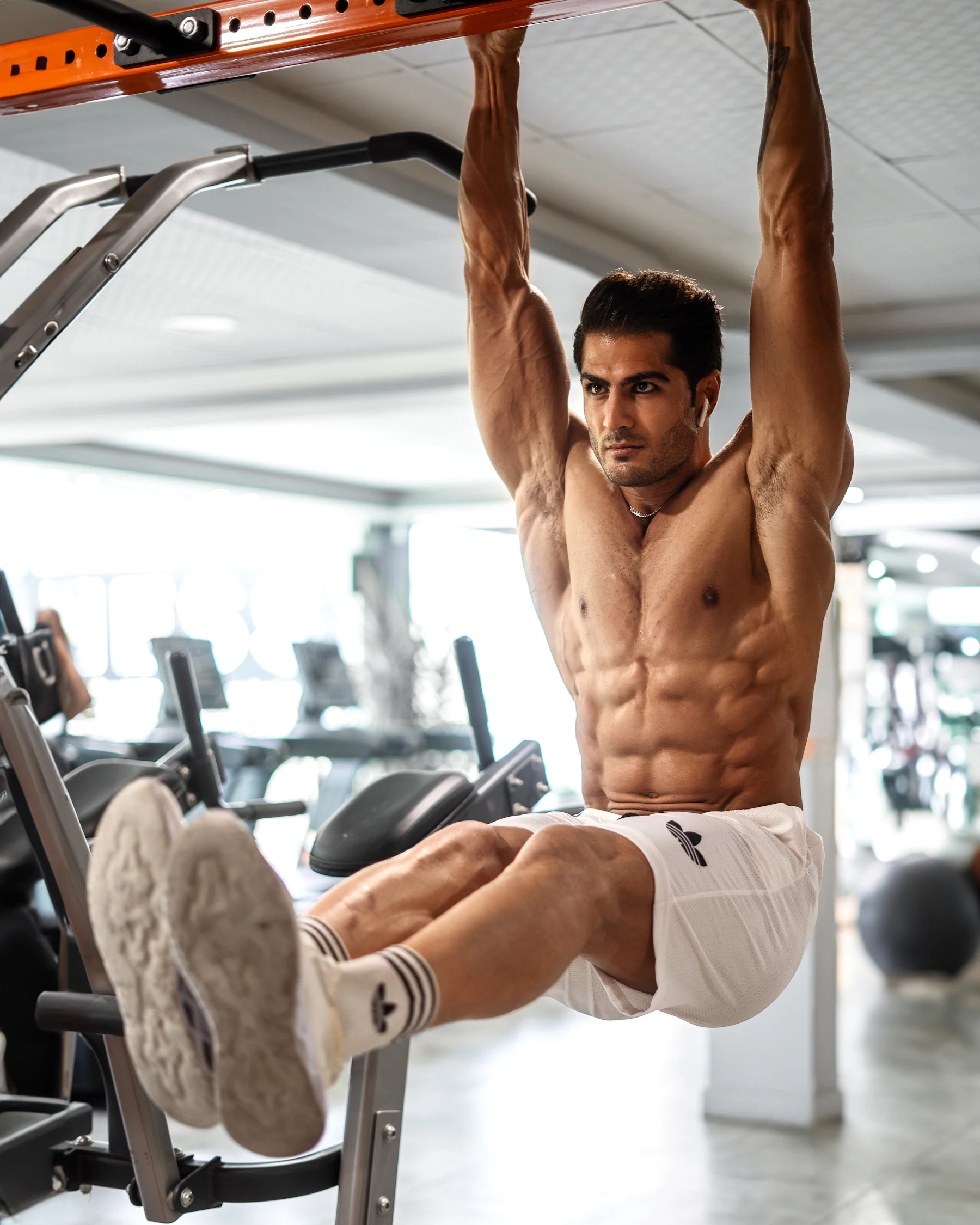 Man performing a pull-up during an upper-body workout