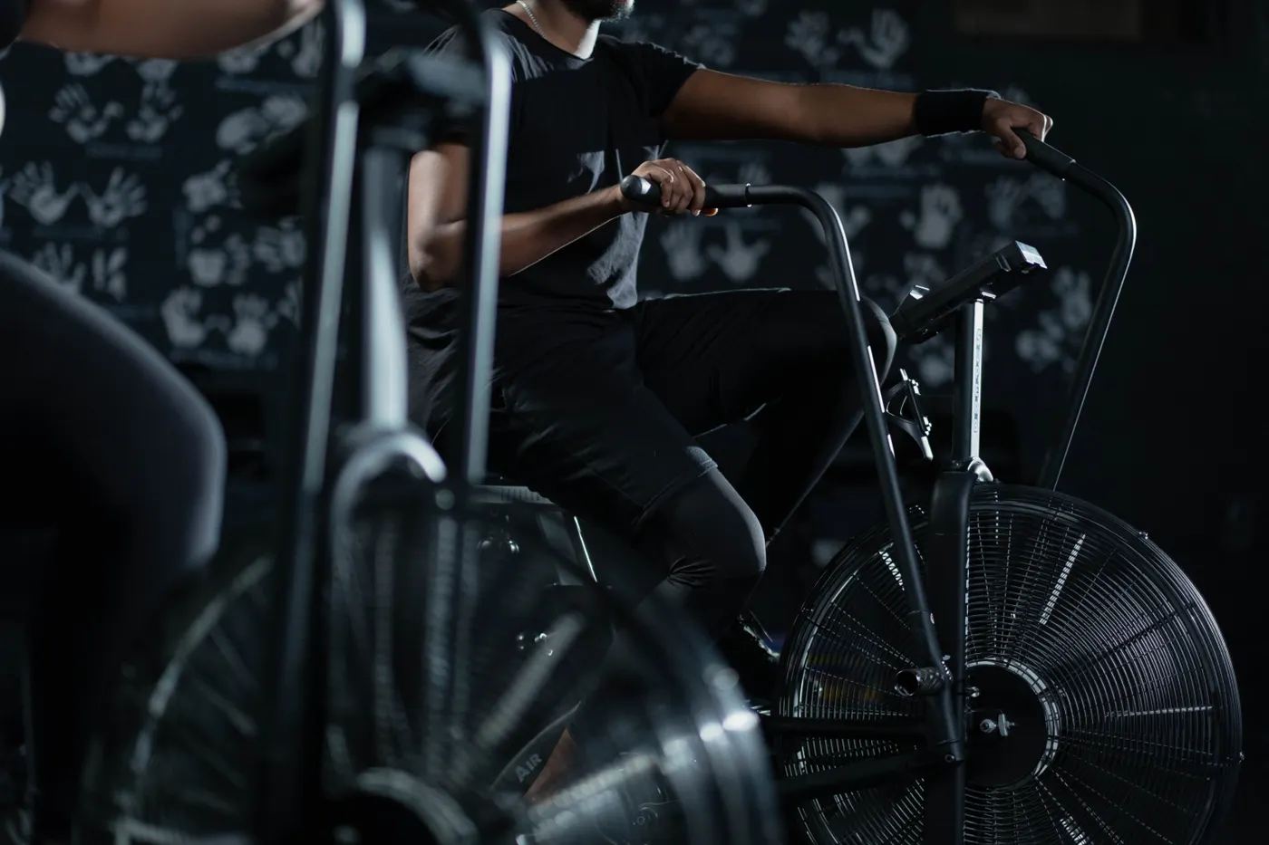Athlete working through a demanding stationary-bike interval