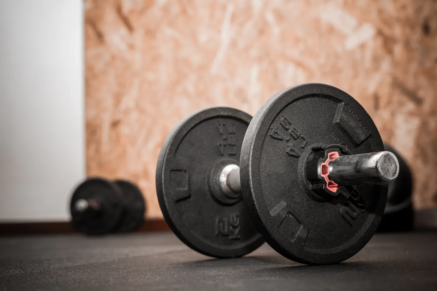 Loadable dumbbell and weights illustrating resistance exercise