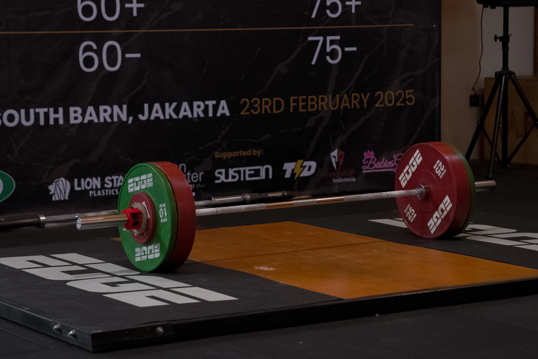 Barbell and bumper plates ready for training