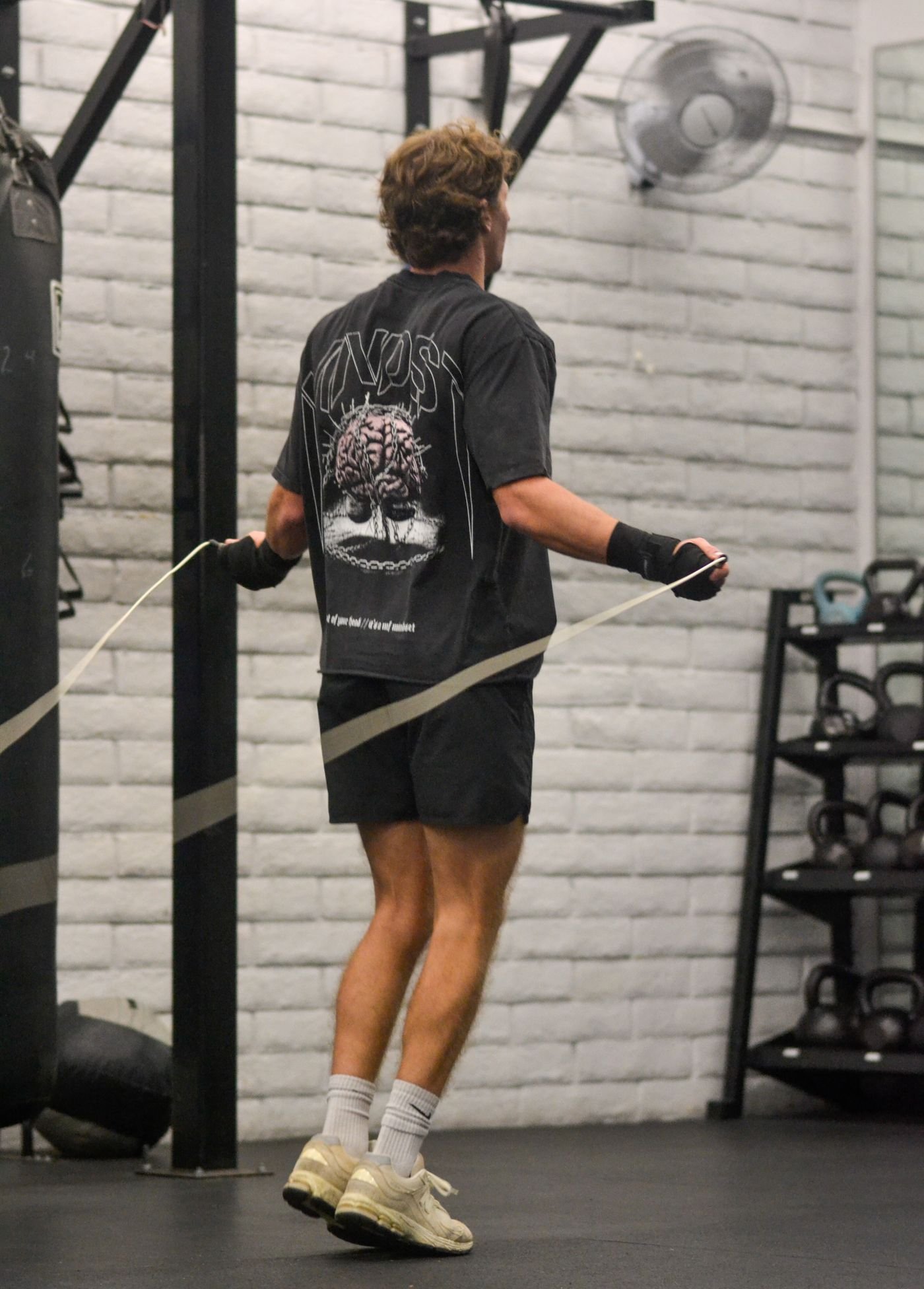 Man jumping rope during gym conditioning
