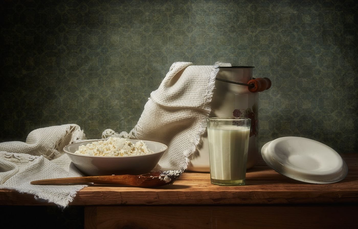 Cottage cheese and milk on a wooden table