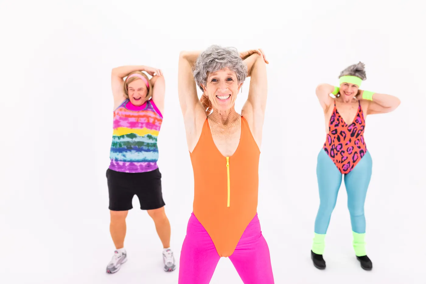 Older women exercising together in a group fitness class