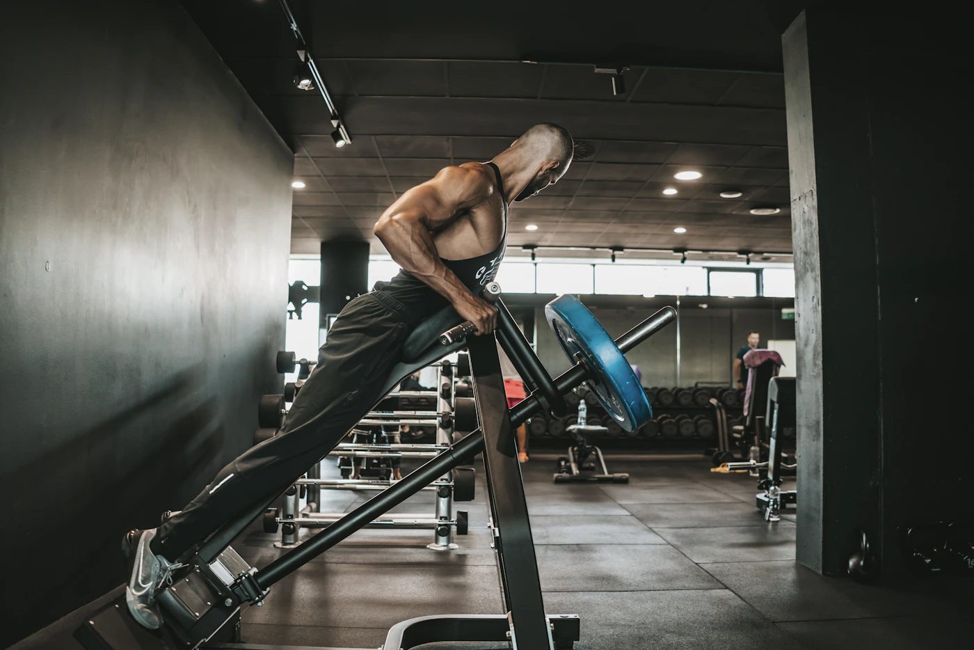 Athlete exercising on a treadmill in a gym