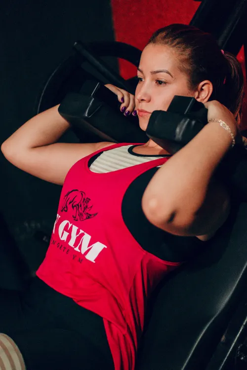 Woman lifting dumbbells during a strength workout