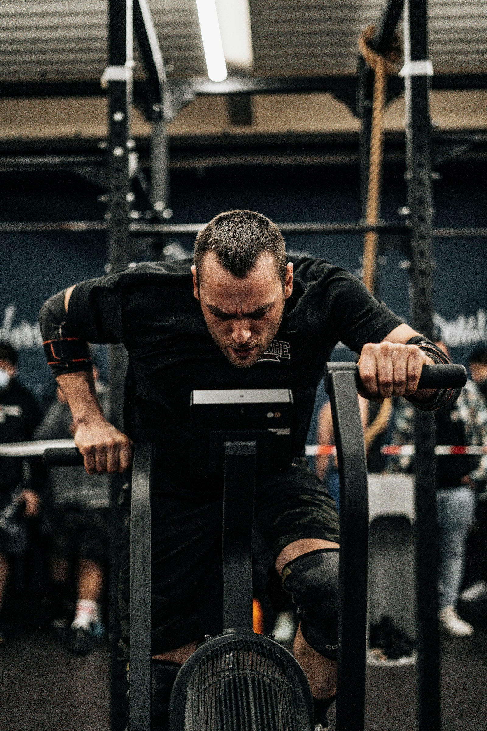 Athlete bench pressing with free weights in a gym