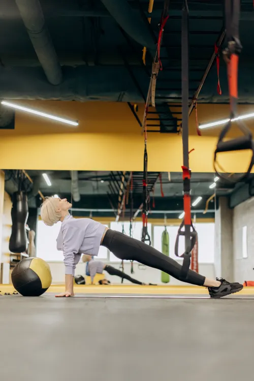 Athlete performing a flexibility exercise in a gym