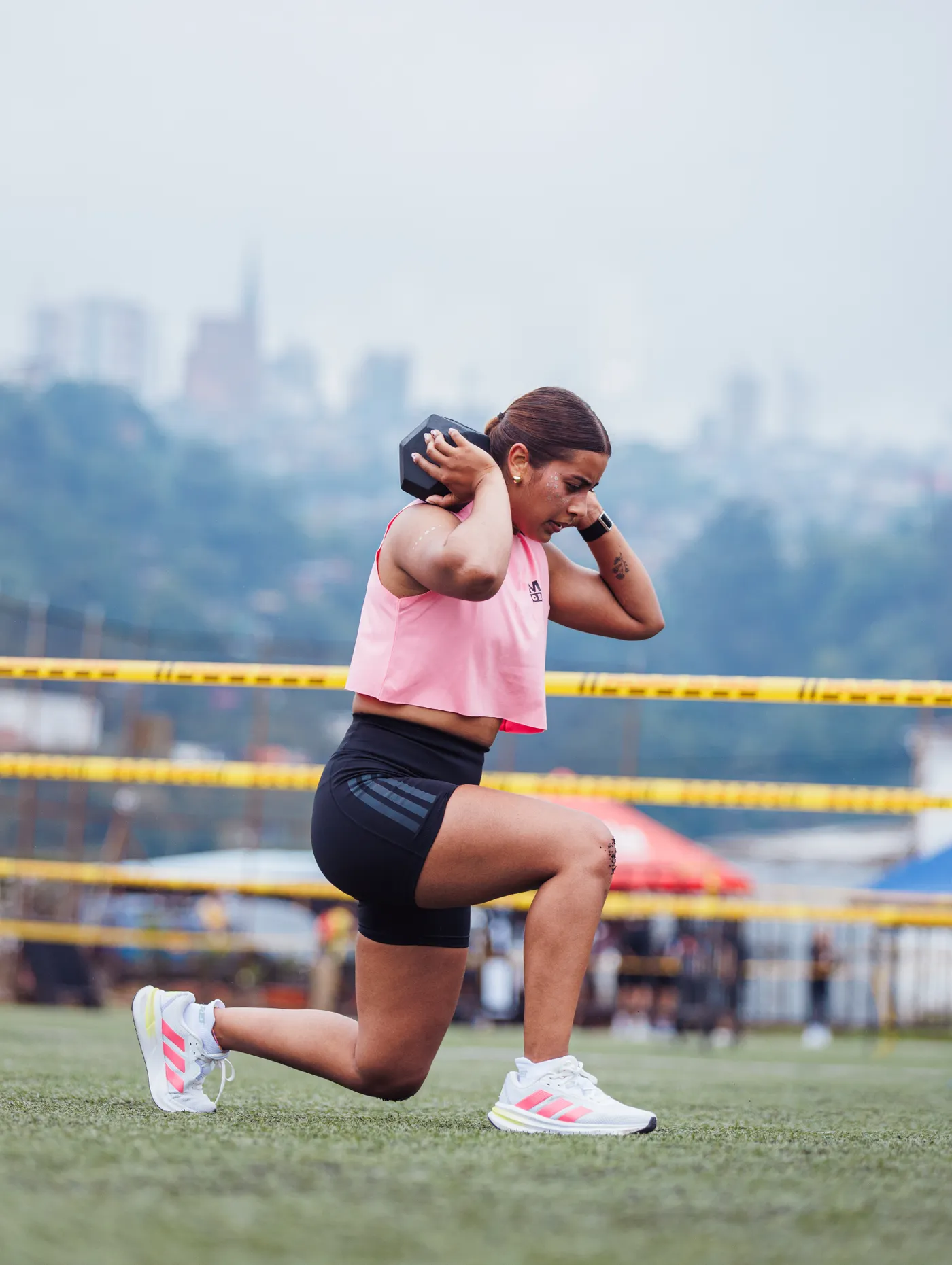 Woman performing a dumbbell lunge