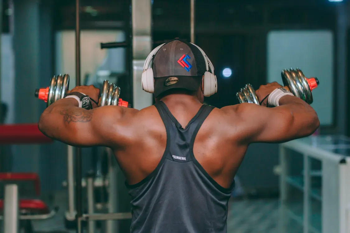 Man lifting dumbbells during a strength workout