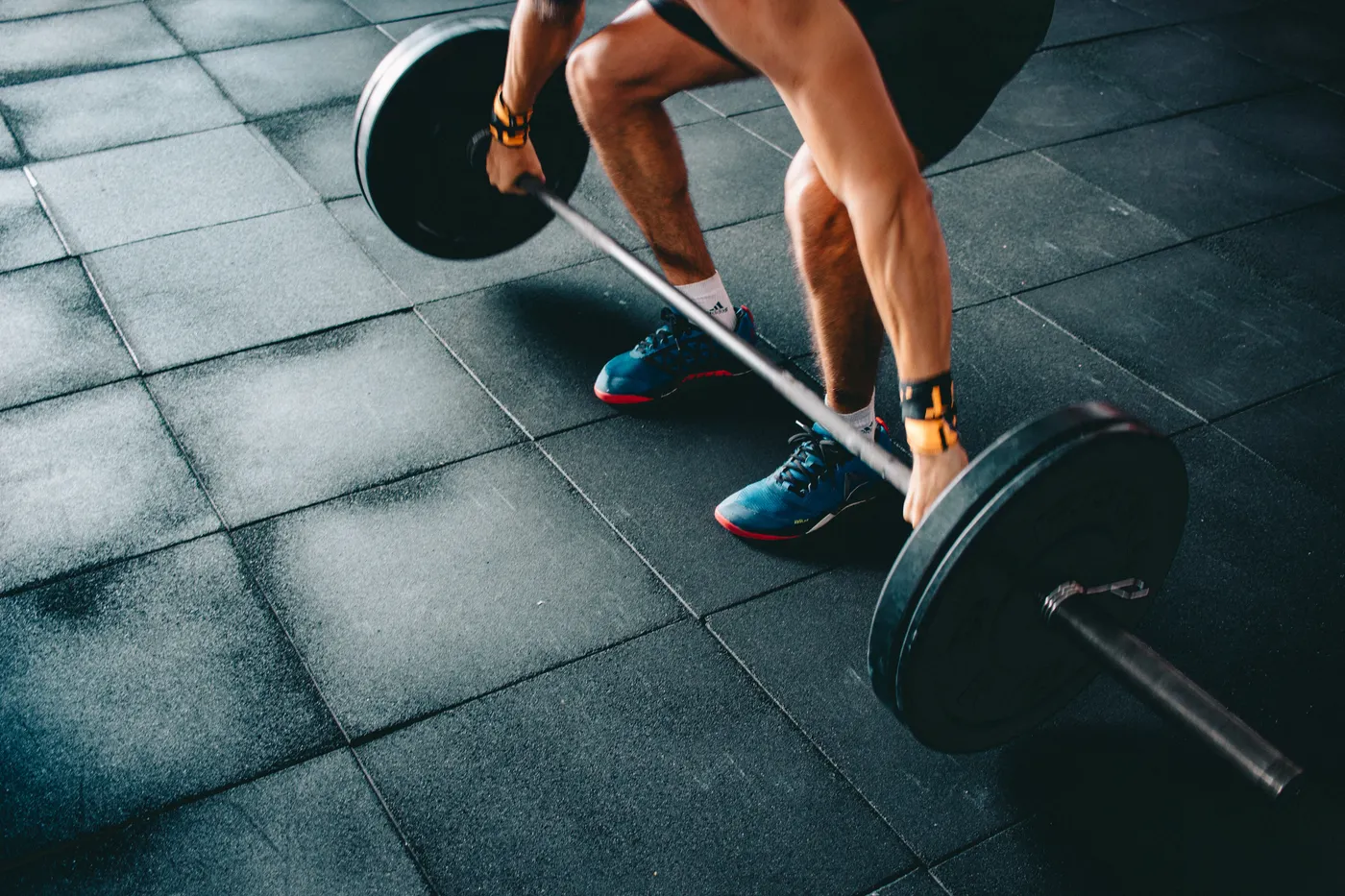Athlete lifting a barbell in a strength-training session