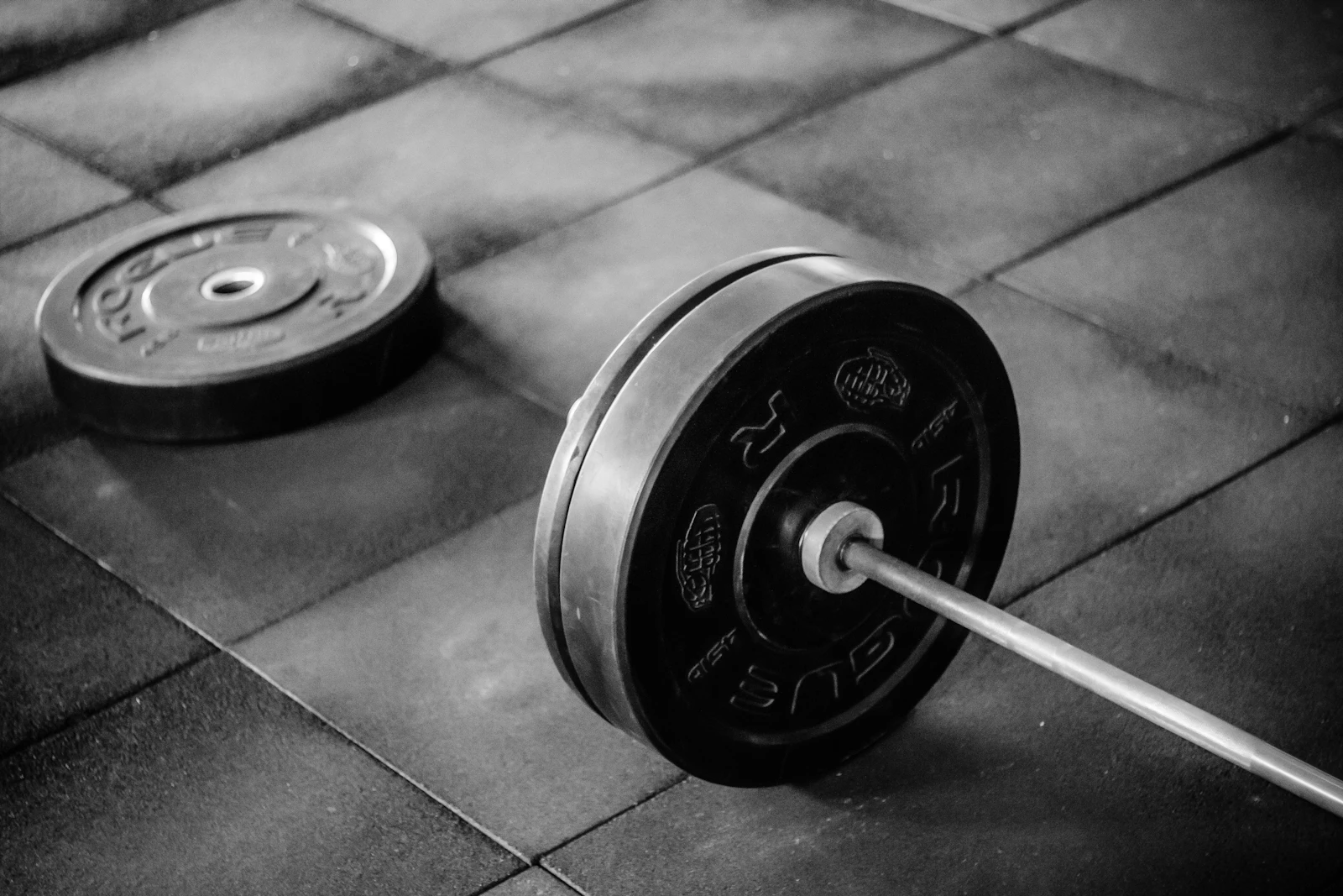Barbell on a gym floor ready for a structured strength-training session