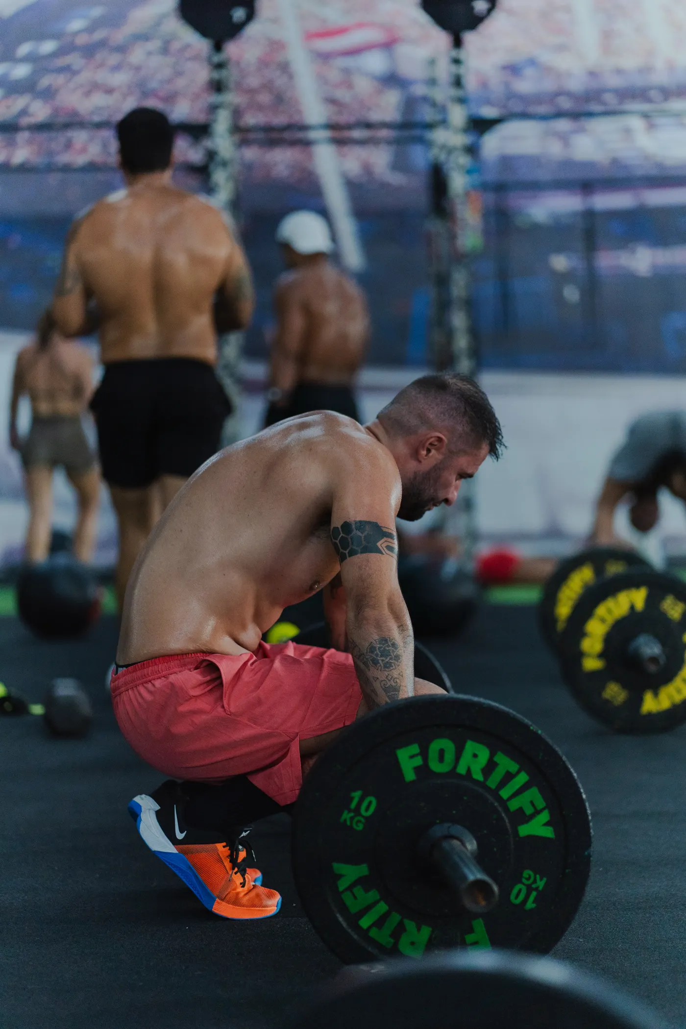 Athlete lifting weights during a strength session in a gym