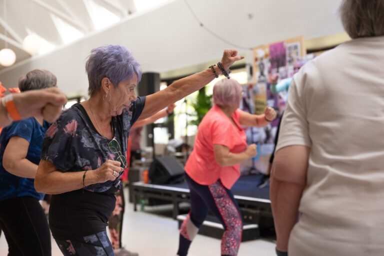 Group of older women exercising together in a fitness class