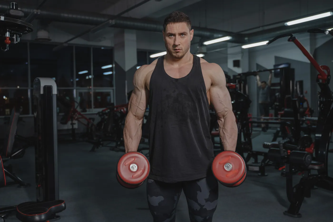 Man lifting dumbbells during an arm workout