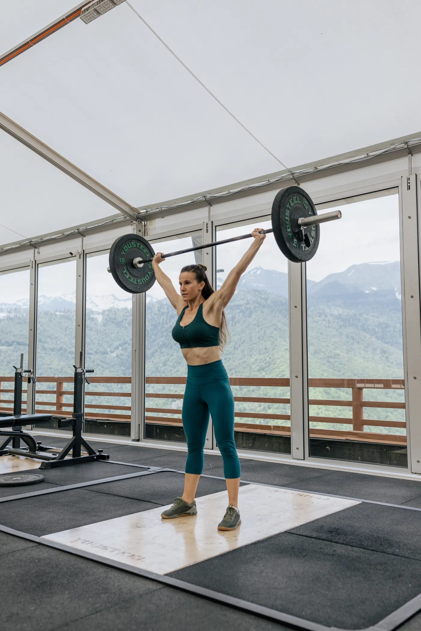 Woman lifting a barbell during strength training