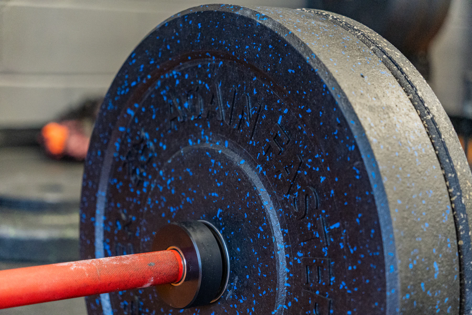 Loaded barbell and weight plates prepared for strength work