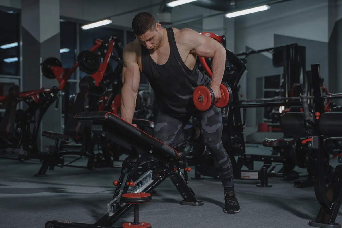 Man lifting dumbbells during strength training