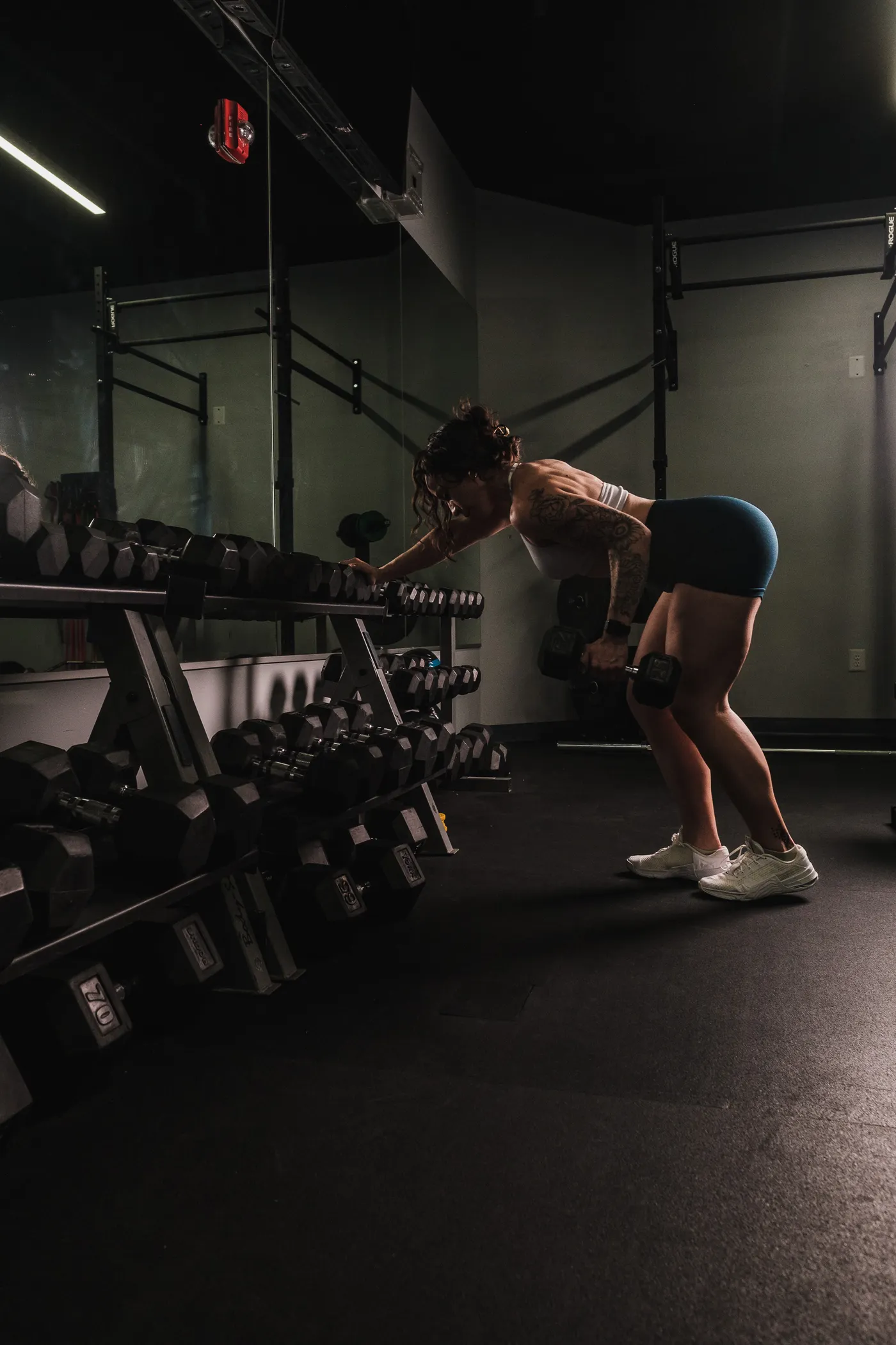 Woman performing a dumbbell row during resistance training