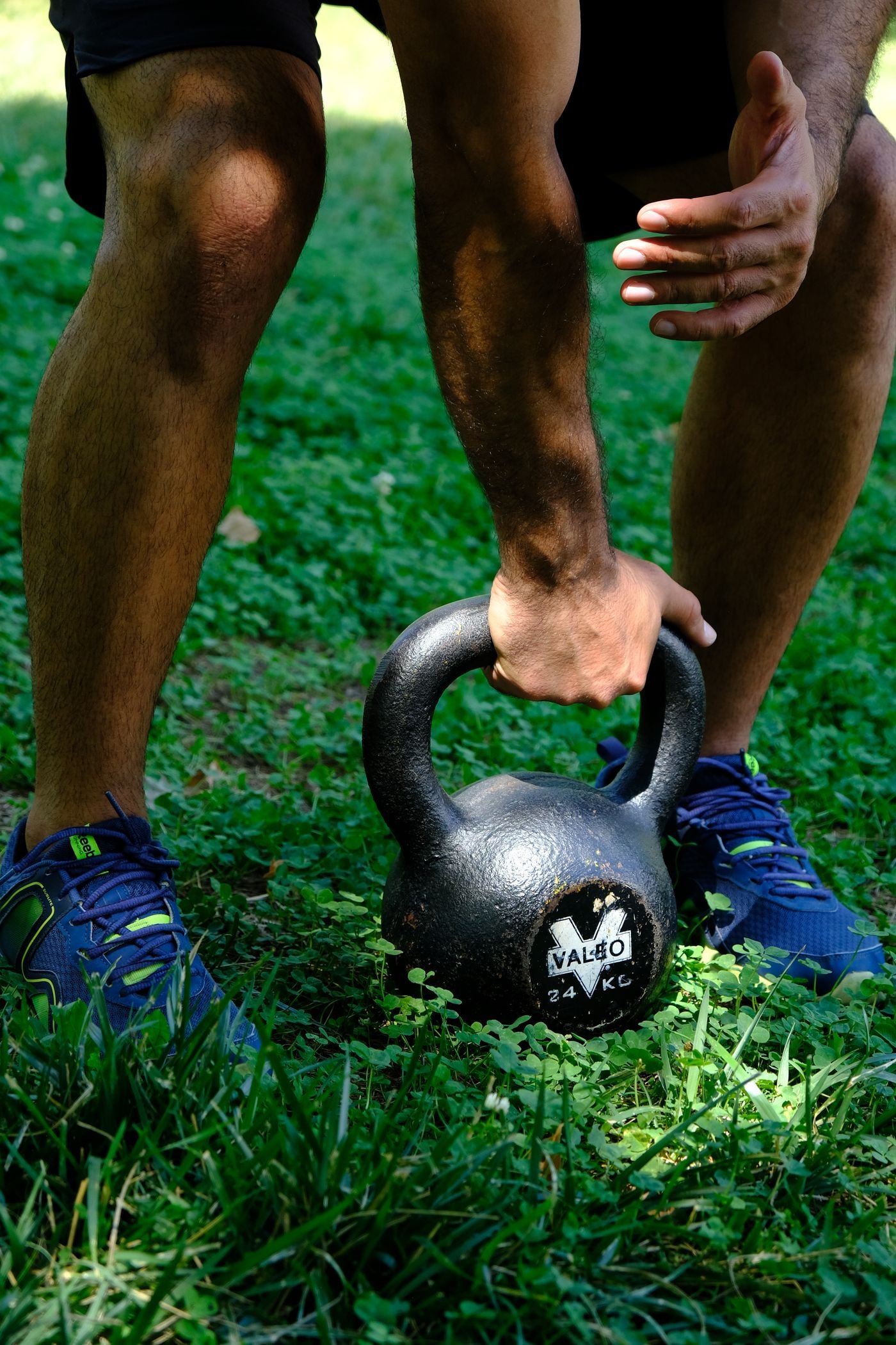 Athlete holding a kettlebell during outdoor training