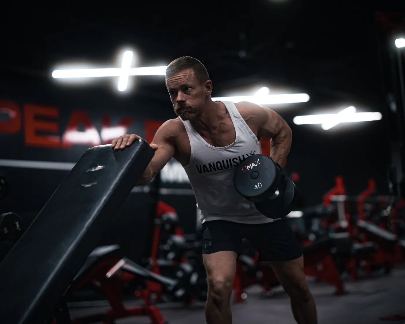 Lifter performing a dumbbell row during strength training