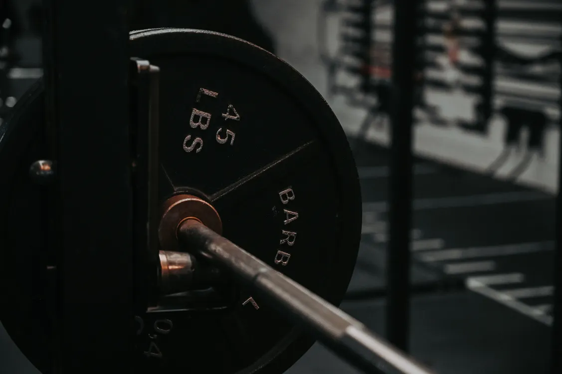 Close-up of a loaded barbell and weight plate