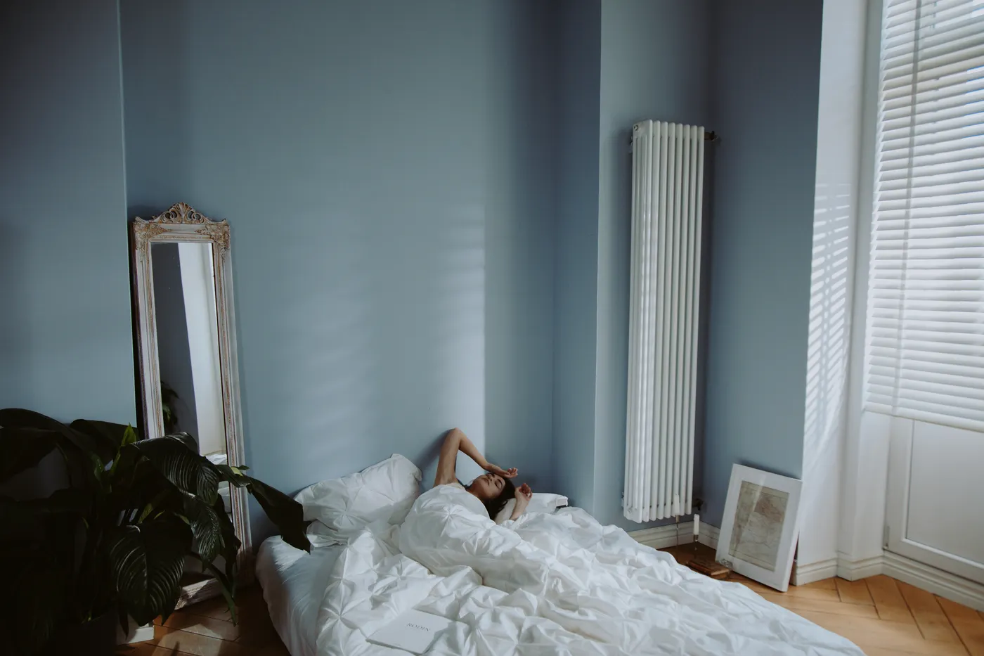 Woman resting in a bright bedroom