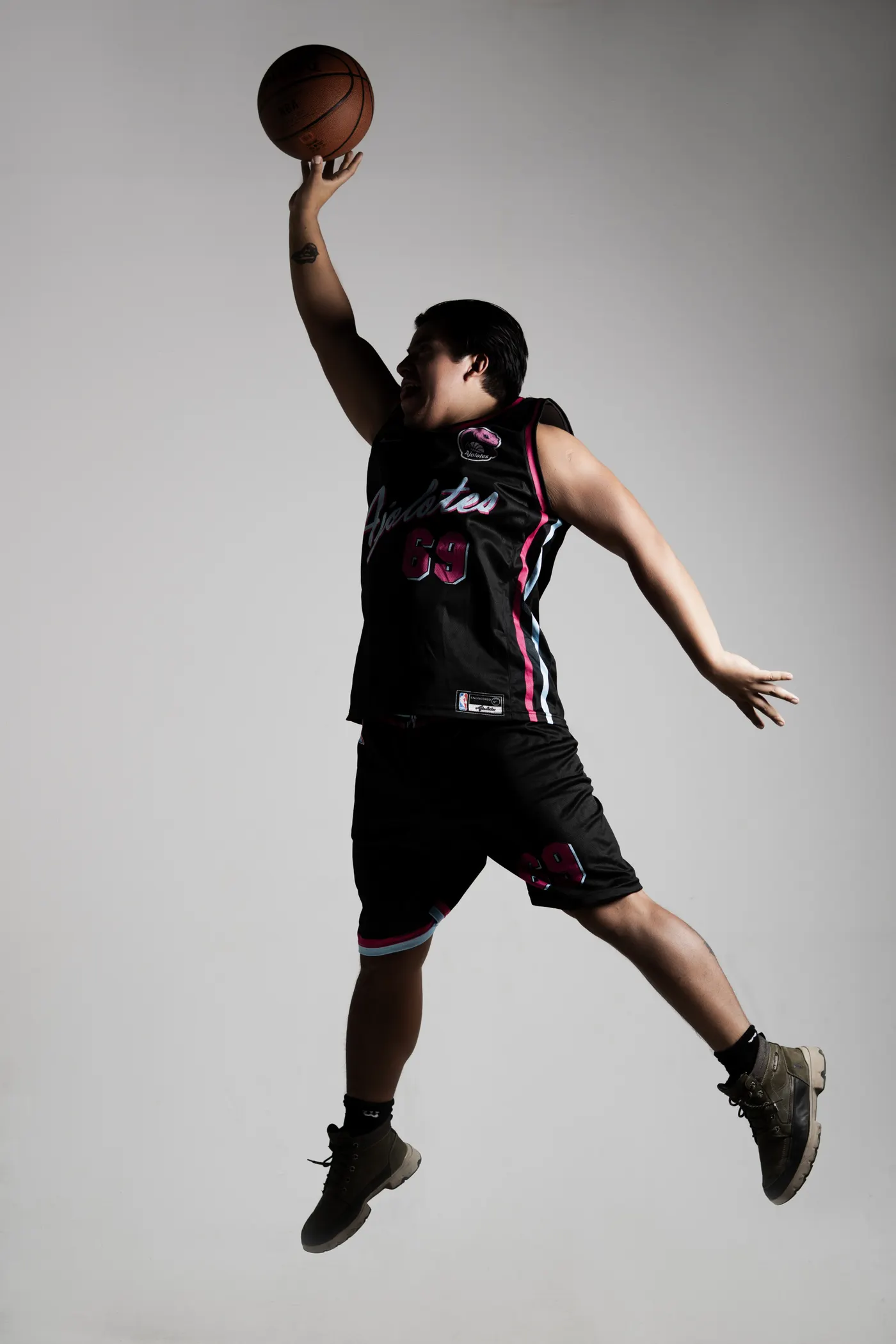 Basketball player jumping with a ball during practice