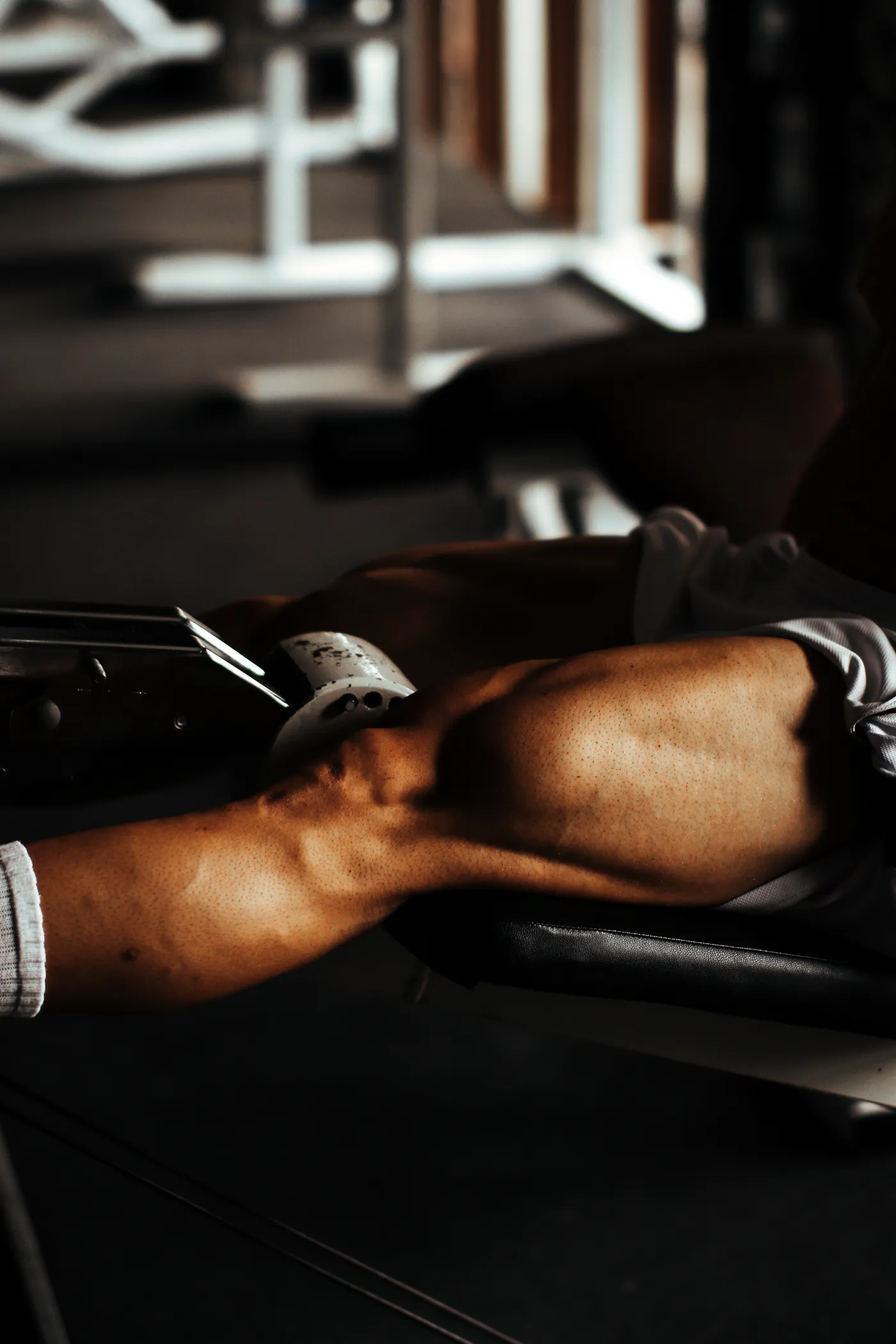 Close view of an athlete's legs during a gym workout