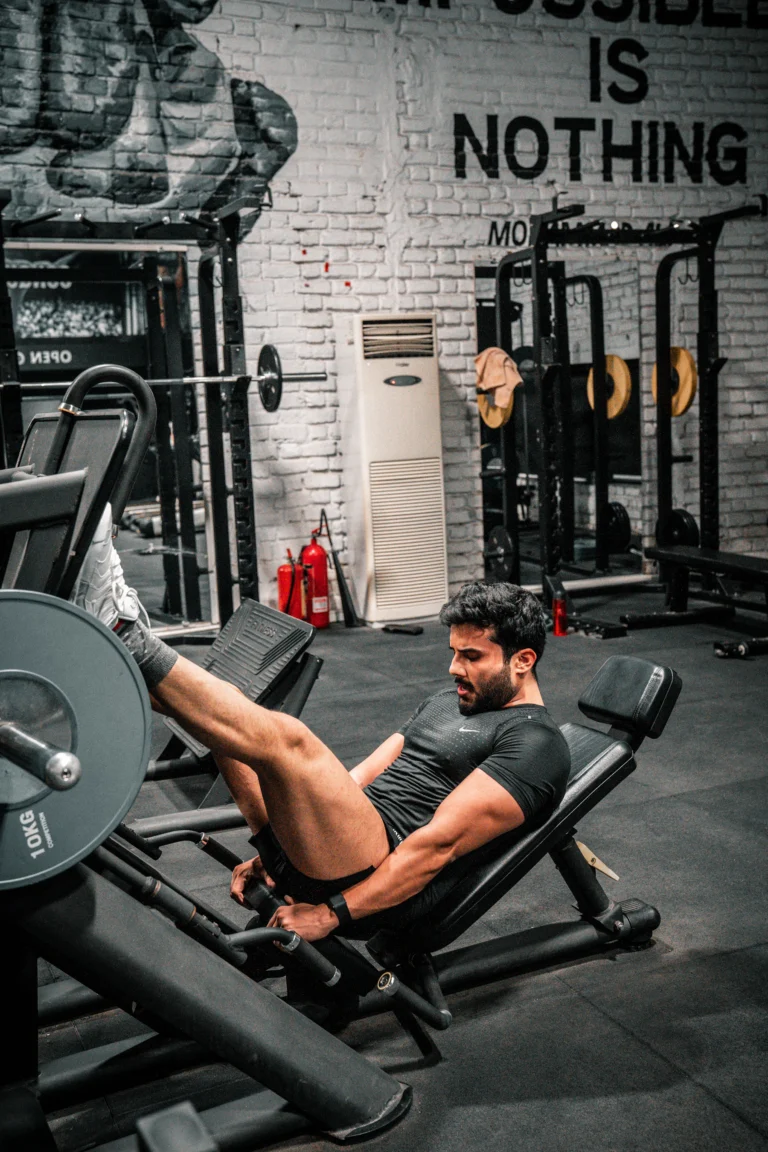Athlete using a leg press machine for controlled lower-body strength training