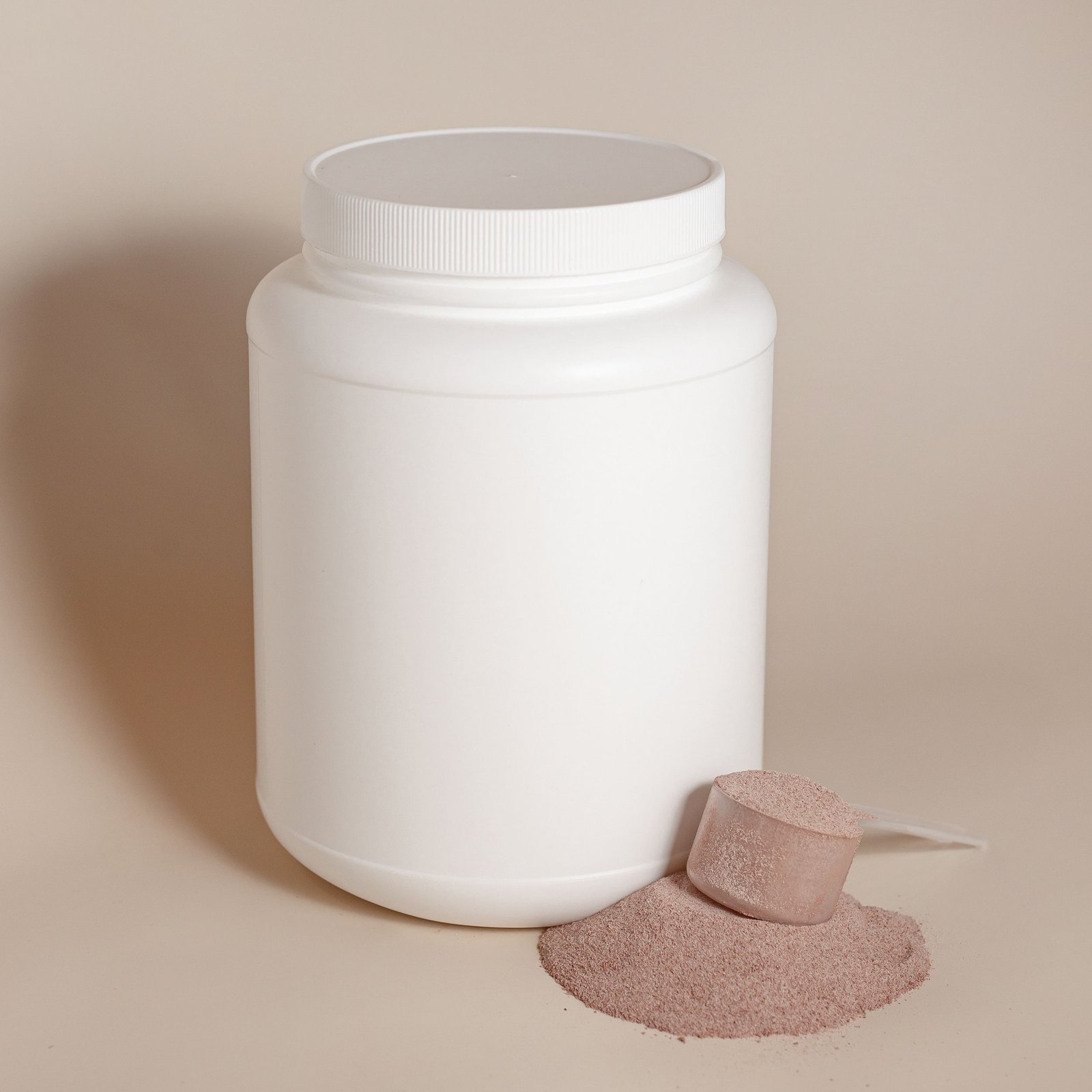 Unlabeled powder container and measuring scoop