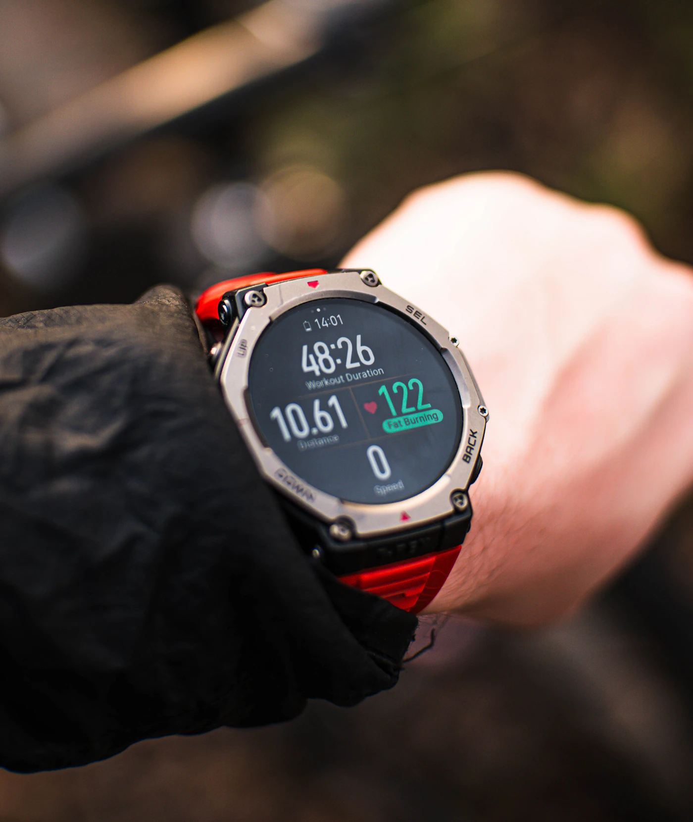 Person checking a fitness watch during outdoor activity