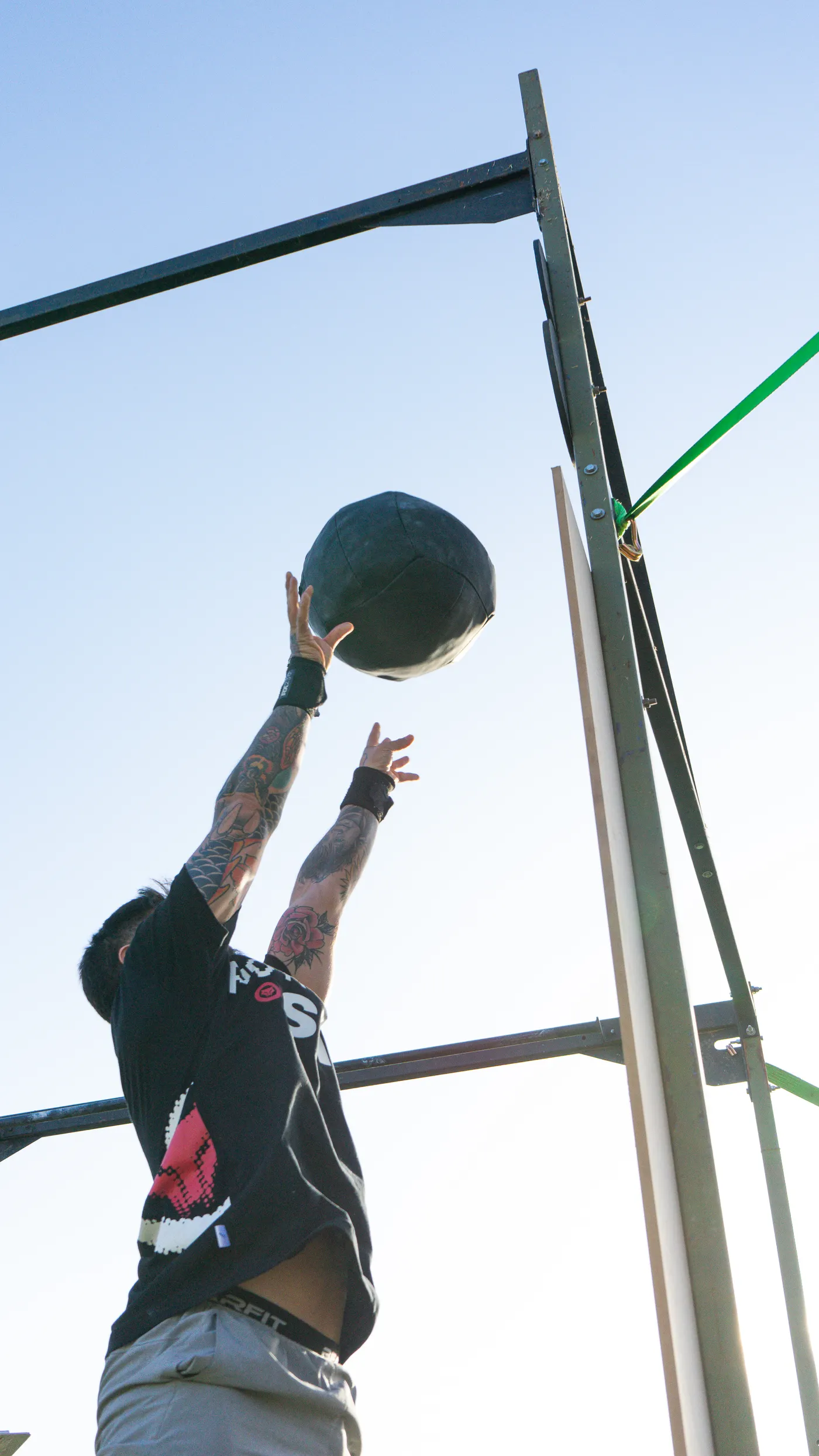 Athlete throwing a medicine ball outdoors during an explosive workout