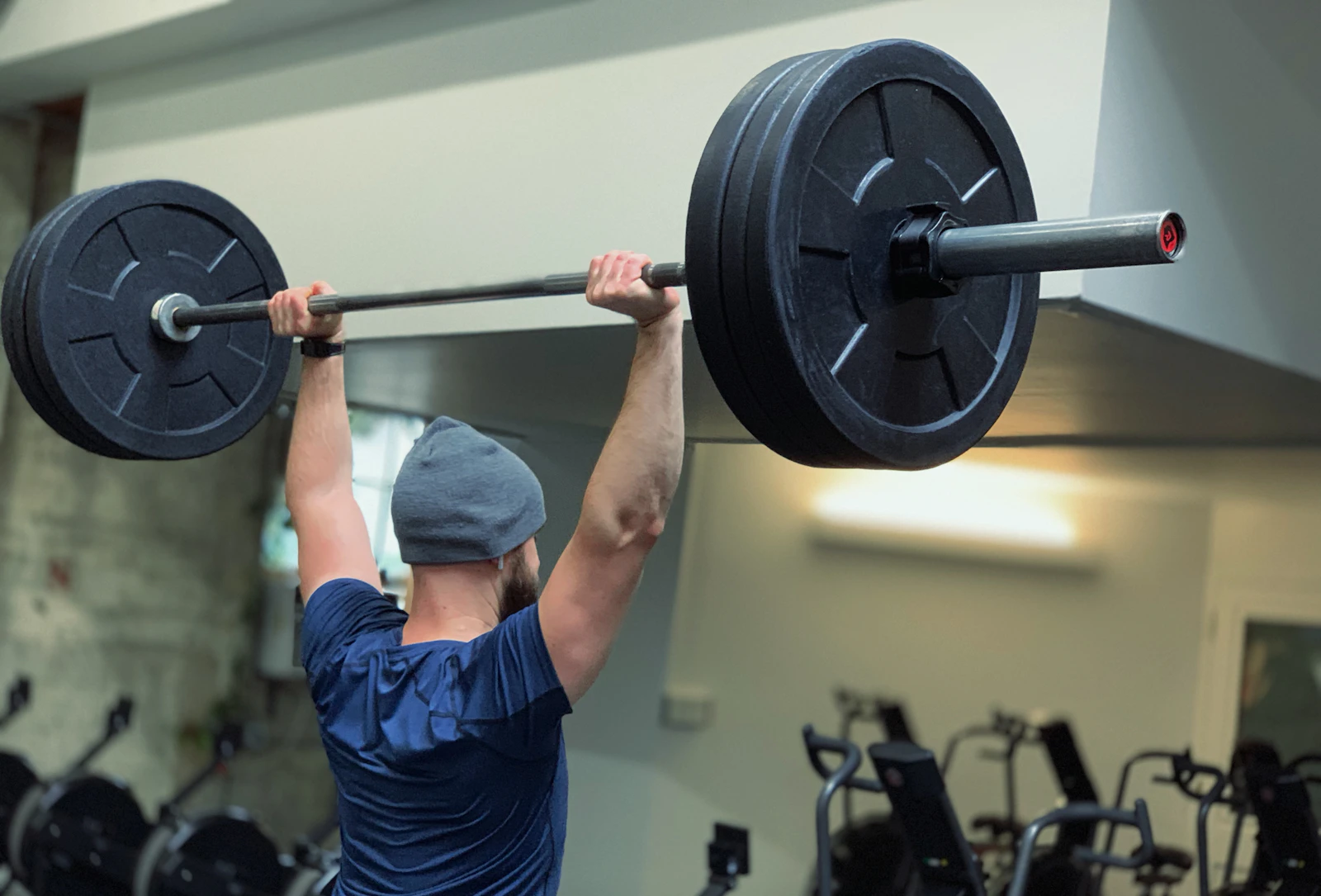 Lifter practicing a barbell movement