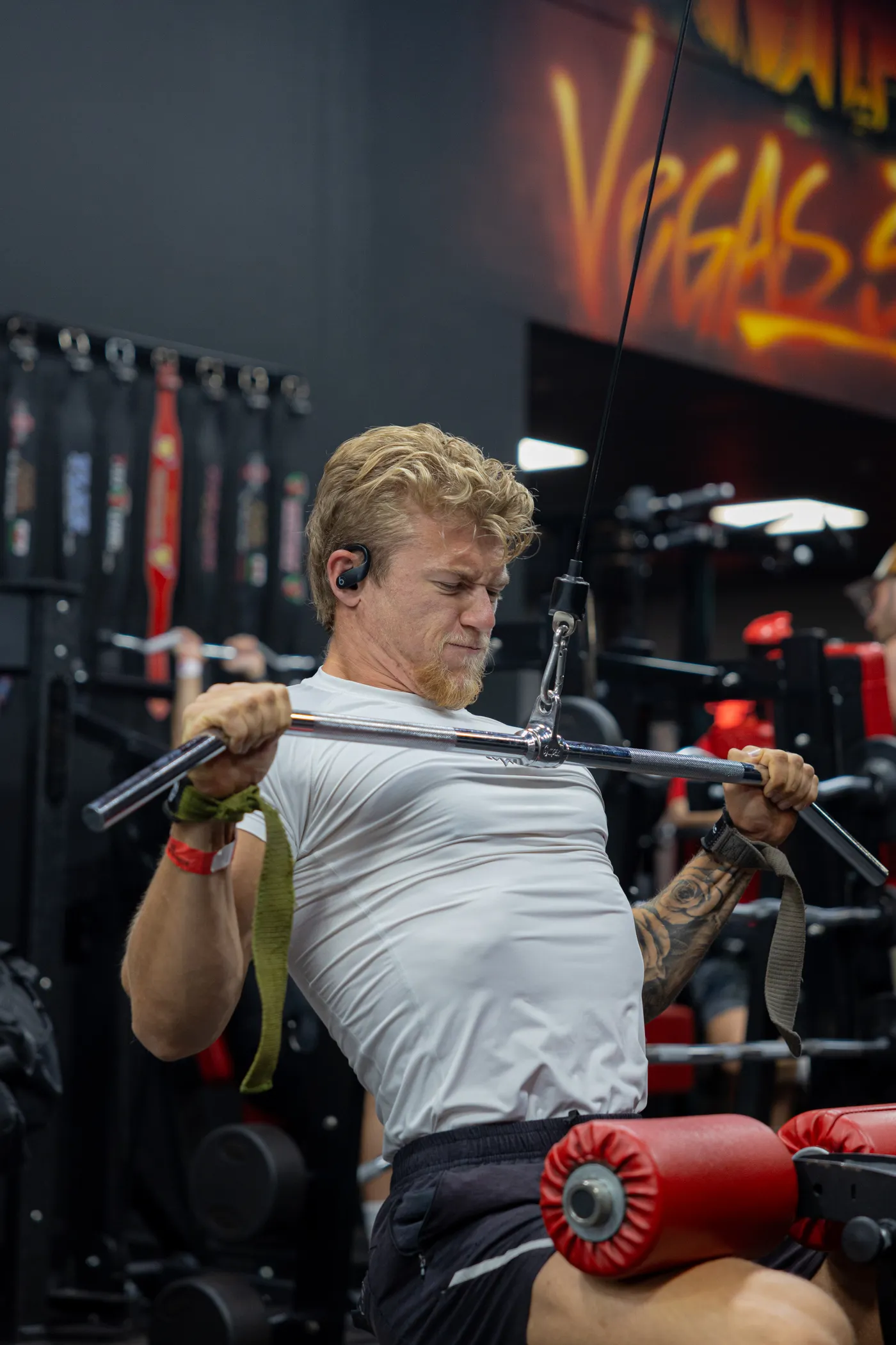 Man performing a lat pulldown on a cable machine