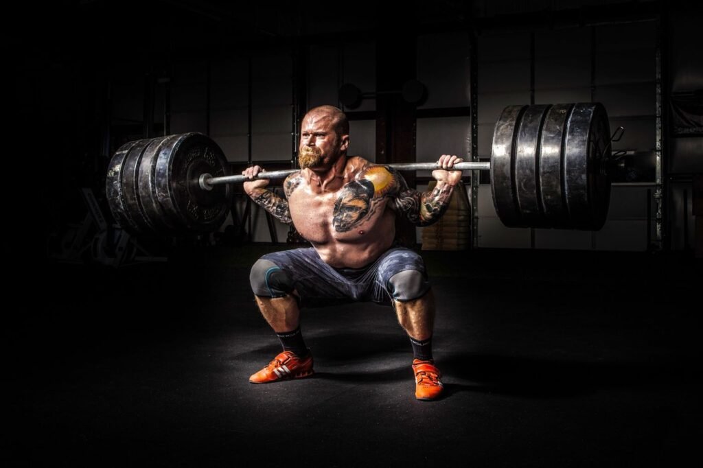 Powerlifter performing a heavy barbell squat in the gym