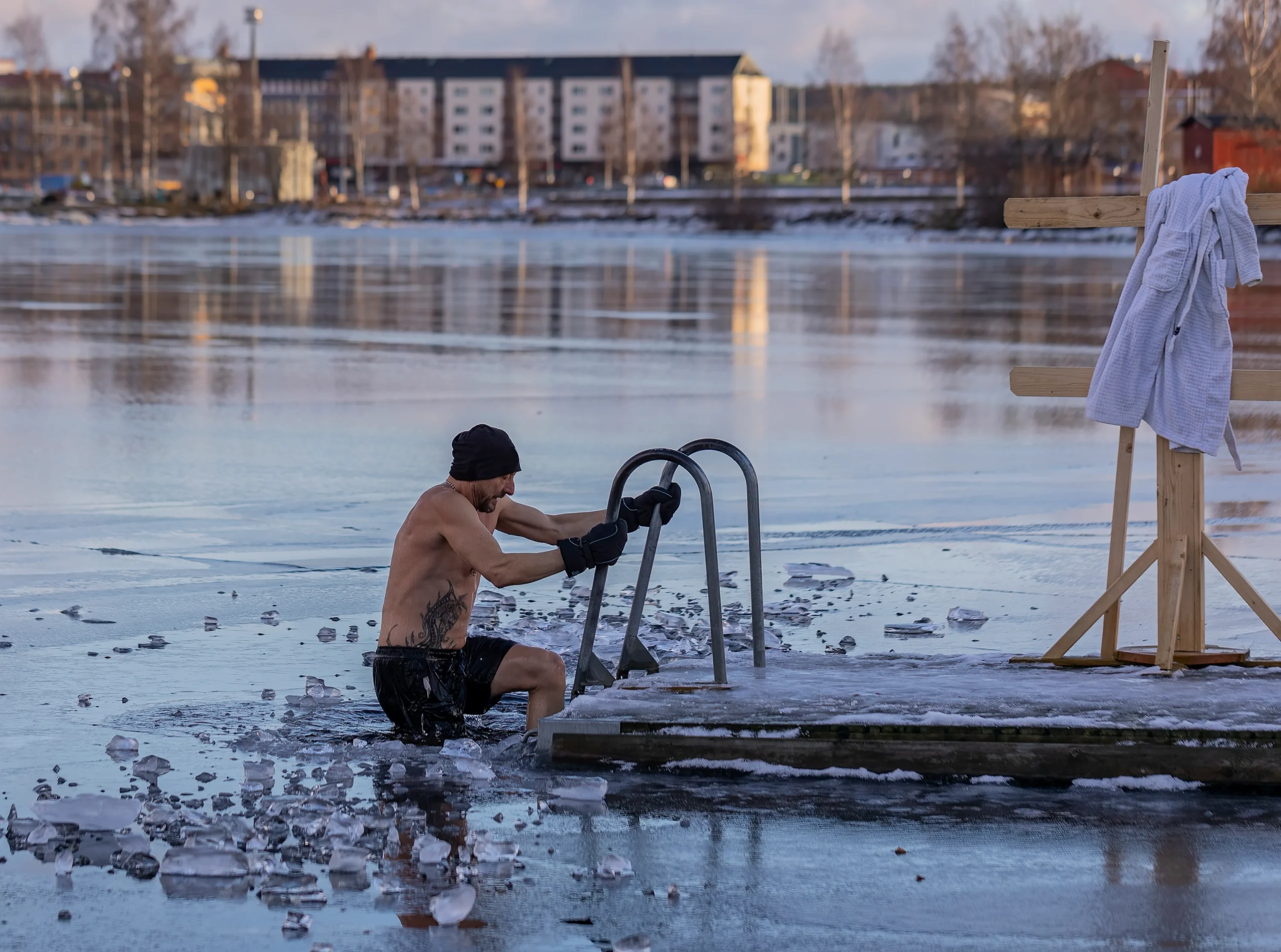 Person taking a cold plunge in an icy lake