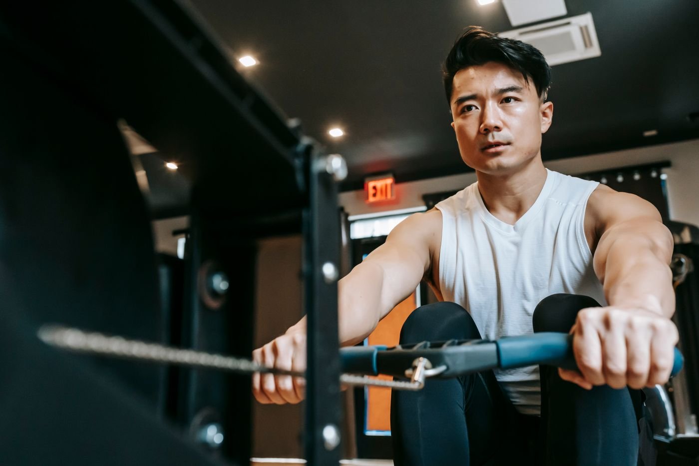 Athlete working through a rowing machine stroke