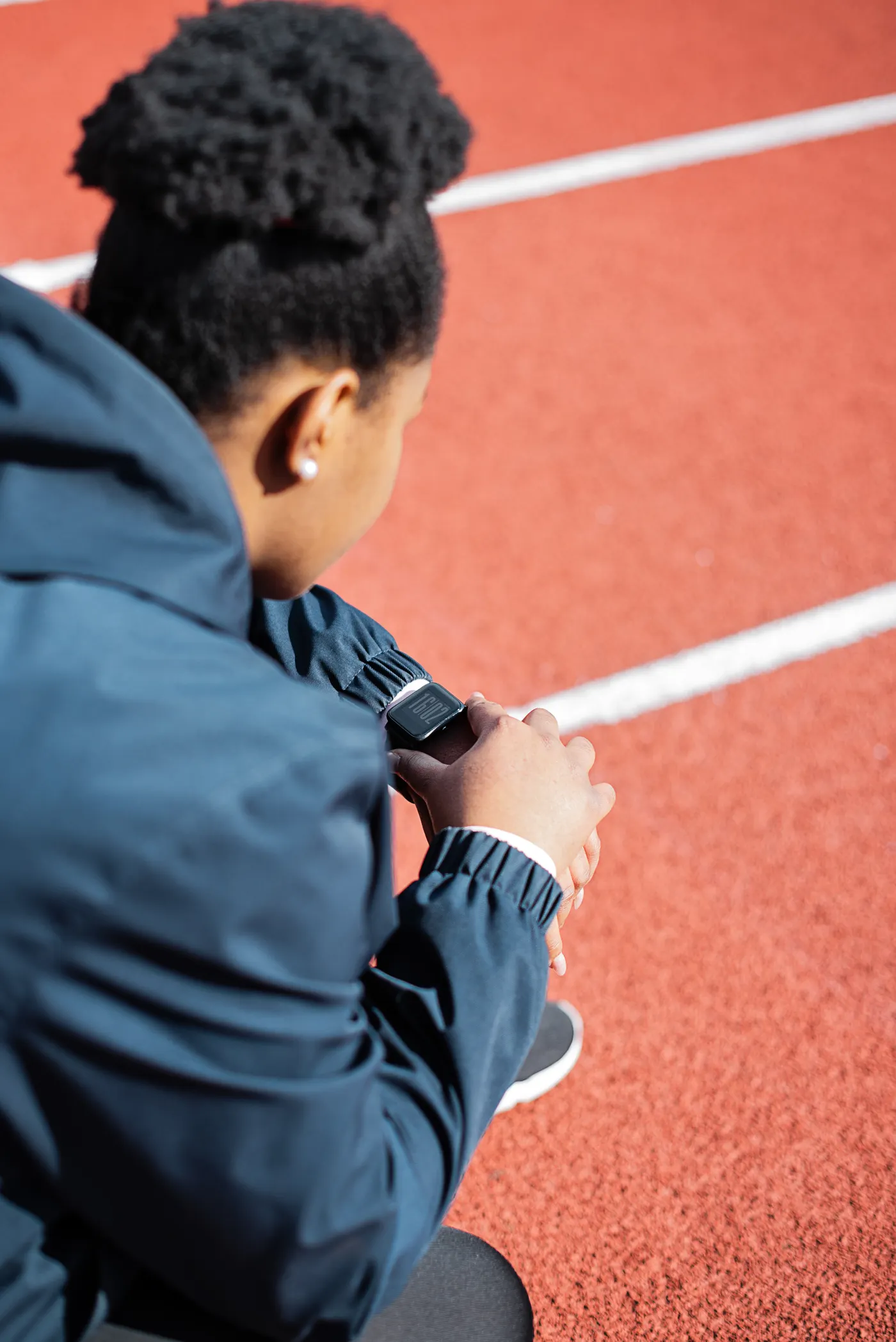 Athlete checking a wristwatch before exercise